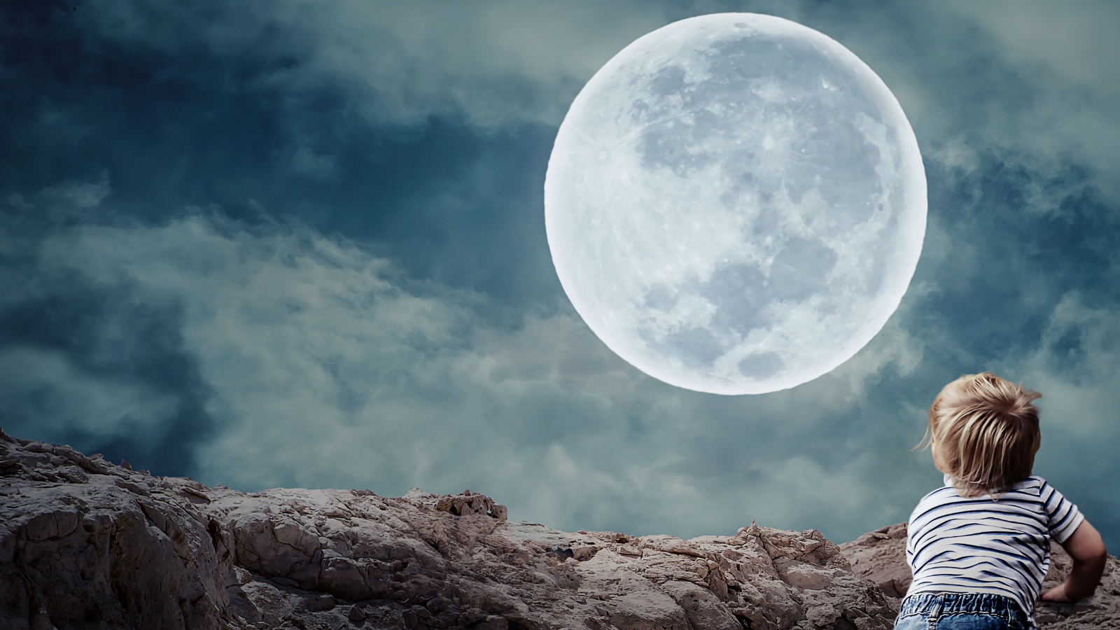 Child enjoying the magic of the full moon